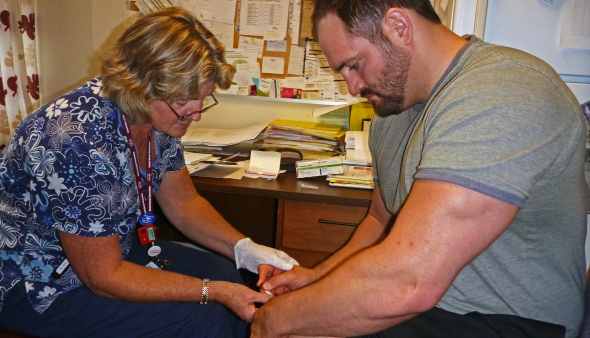 Nurse Ann Port administering Devon's first dose of Interferon at the Ottawa Civic Hospital